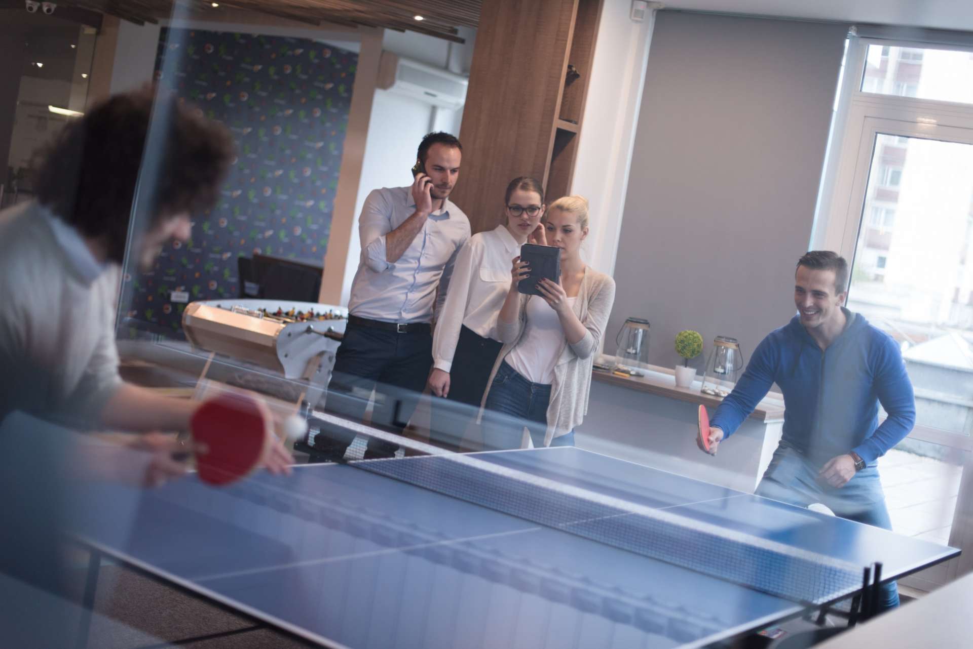 P11 ctouch business team playing ping pong tennis min 1