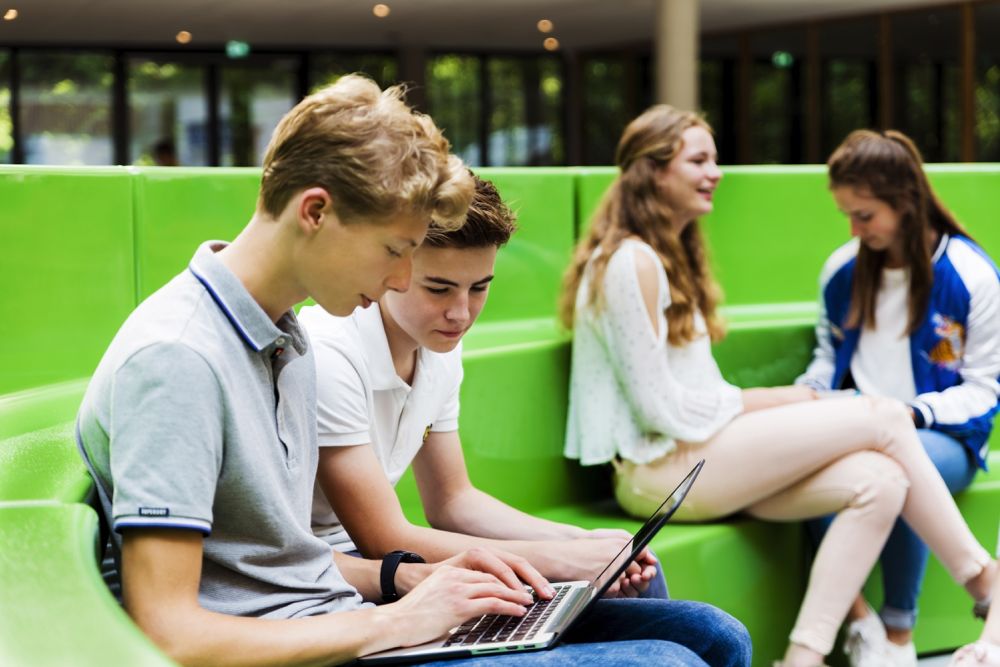 Kids outside on laptop